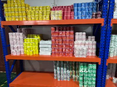 Ecommerce fulfillment warehouse applying address labels to shipping packages